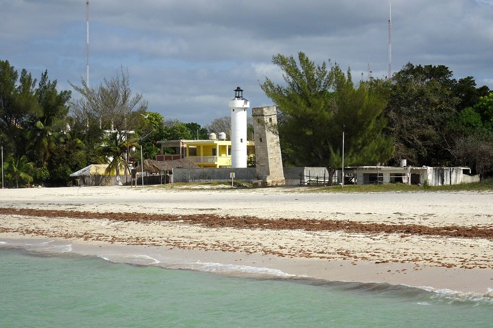 A white lighthouse tower at Celestún