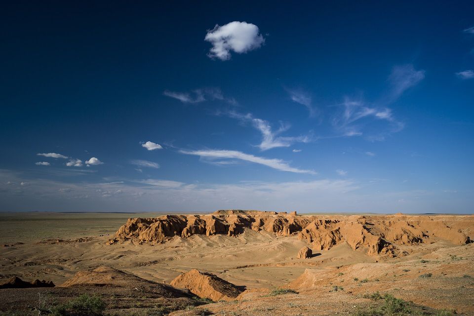 Eroded red sandstone ridges in warm light