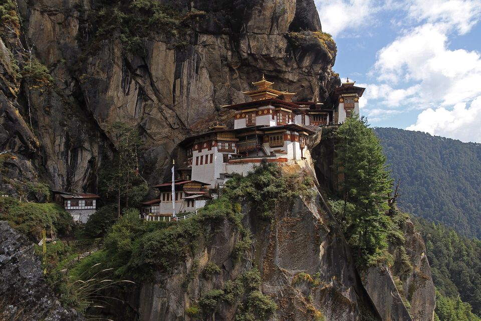Close exterior of the monastery buildings against the cliff